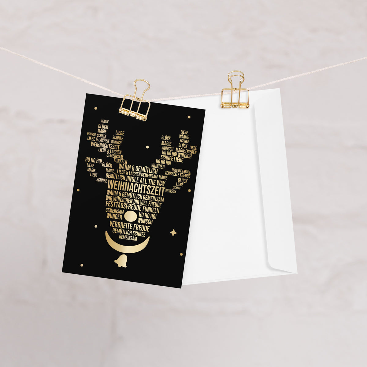Weihnachtskarte mit festlichem Rentiermotiv in Schwarz und Gold