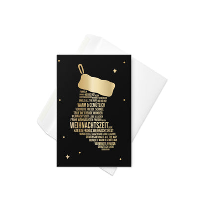 Weihnachtskarte mit goldenem Nikolausstiefel-Motiv, kleinen Sternen und Punkten auf schwarzem Hintergrund